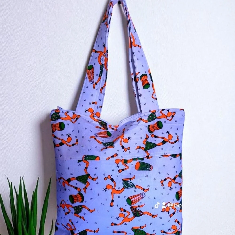 Vibrant Purple Tote Bag with Artistic Design